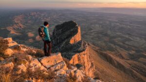man looking over guadalupe peak in texas